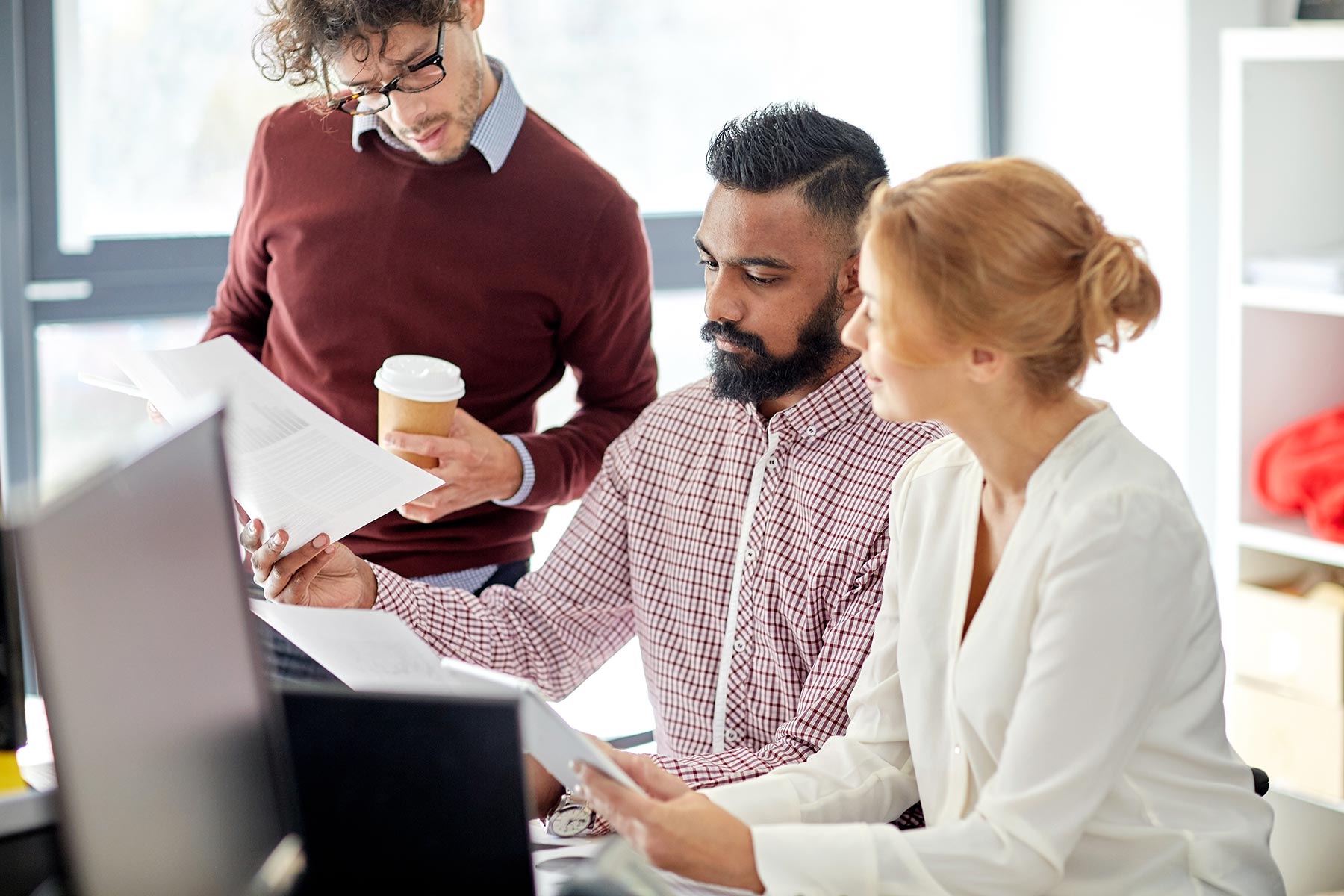 business-team-with-tablet-pc-in-office-PYYS3KX